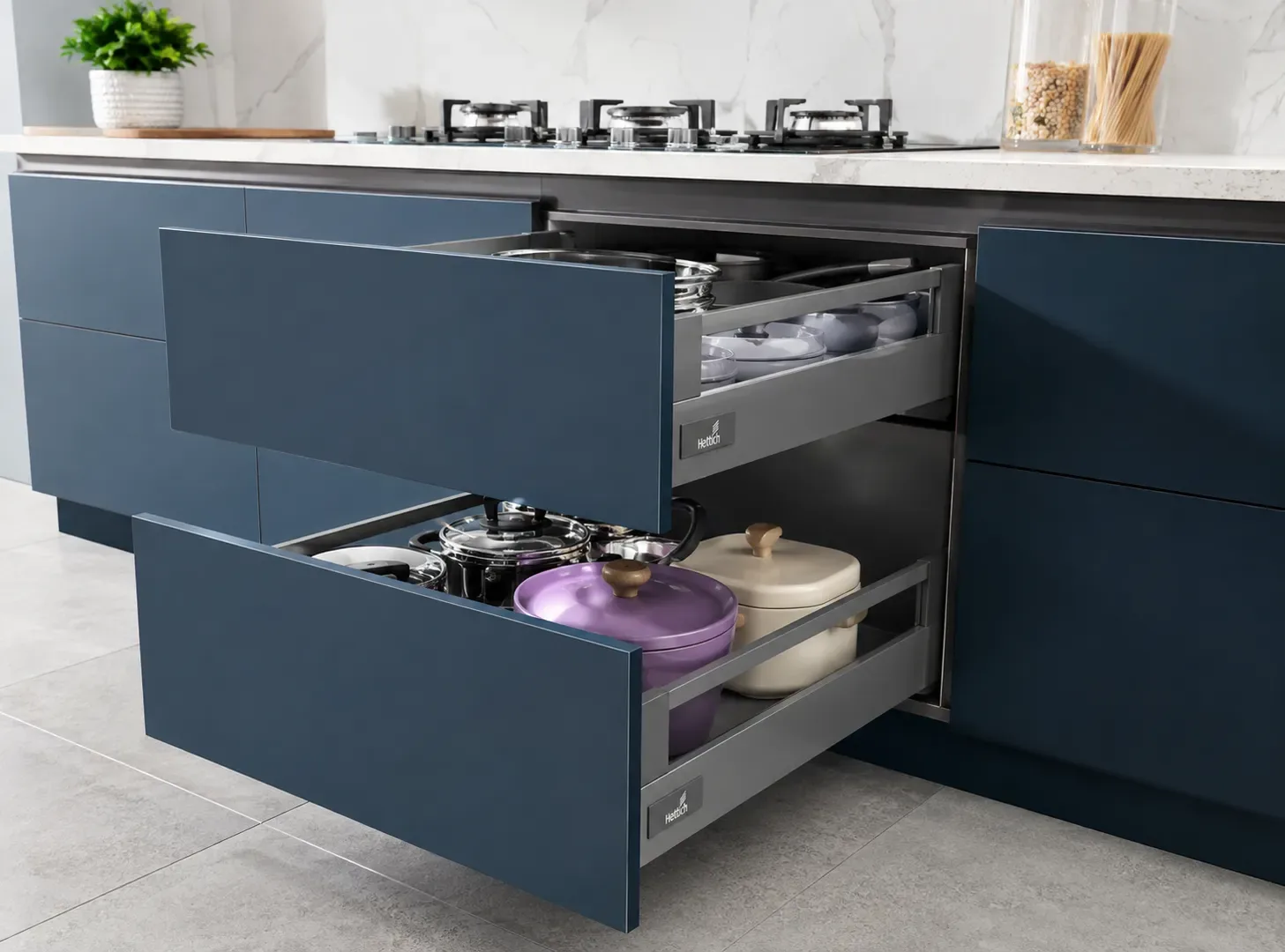Full-extension tandem drawers in an L-shape modular kitchen by Reedify Modulars